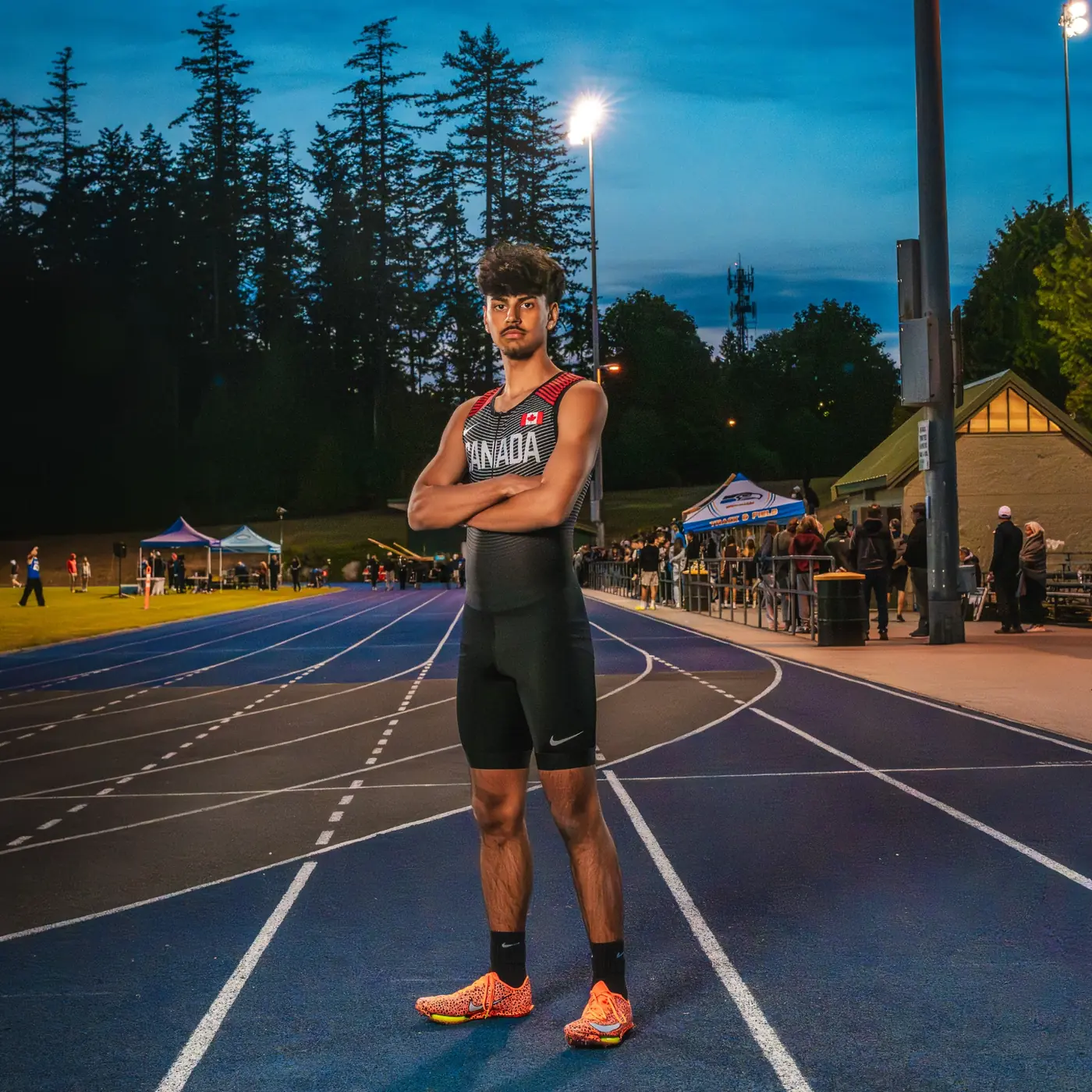 Track athlete posing for a dramatic sports portrait