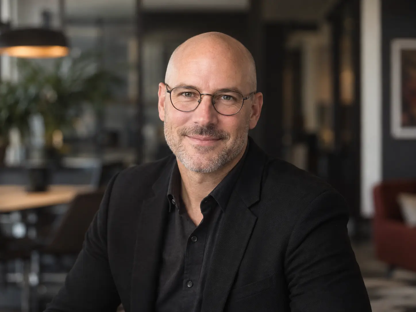 Professional environmental headshot of a man wearing glasses