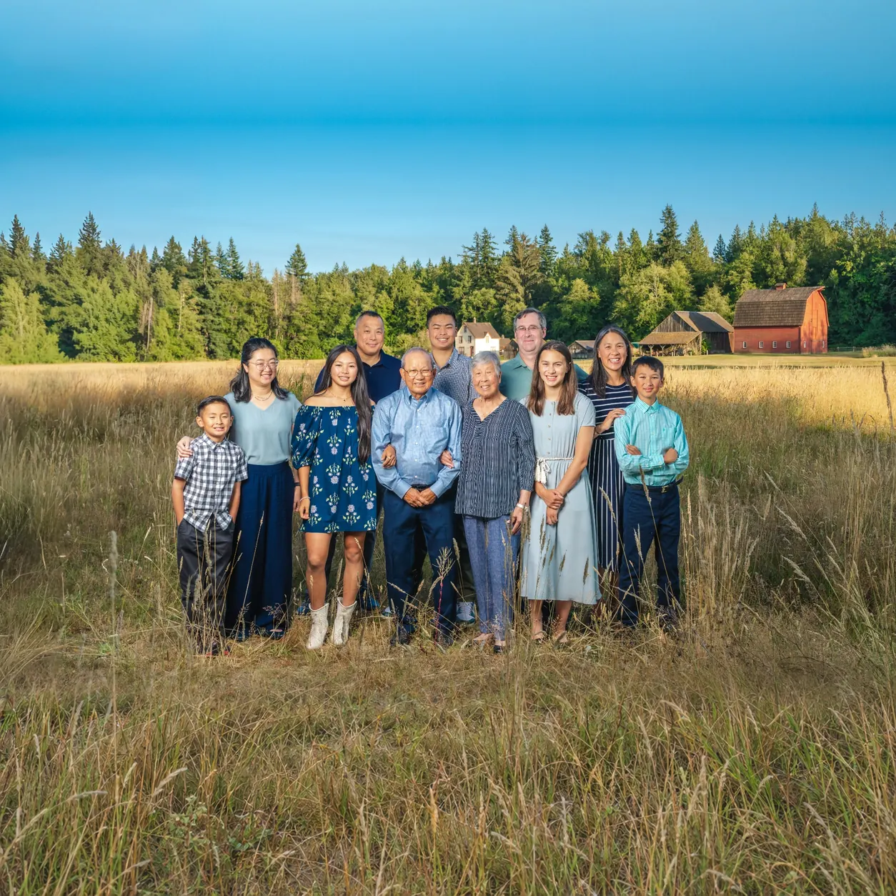 Extended family gathered together for an outdoor portrait