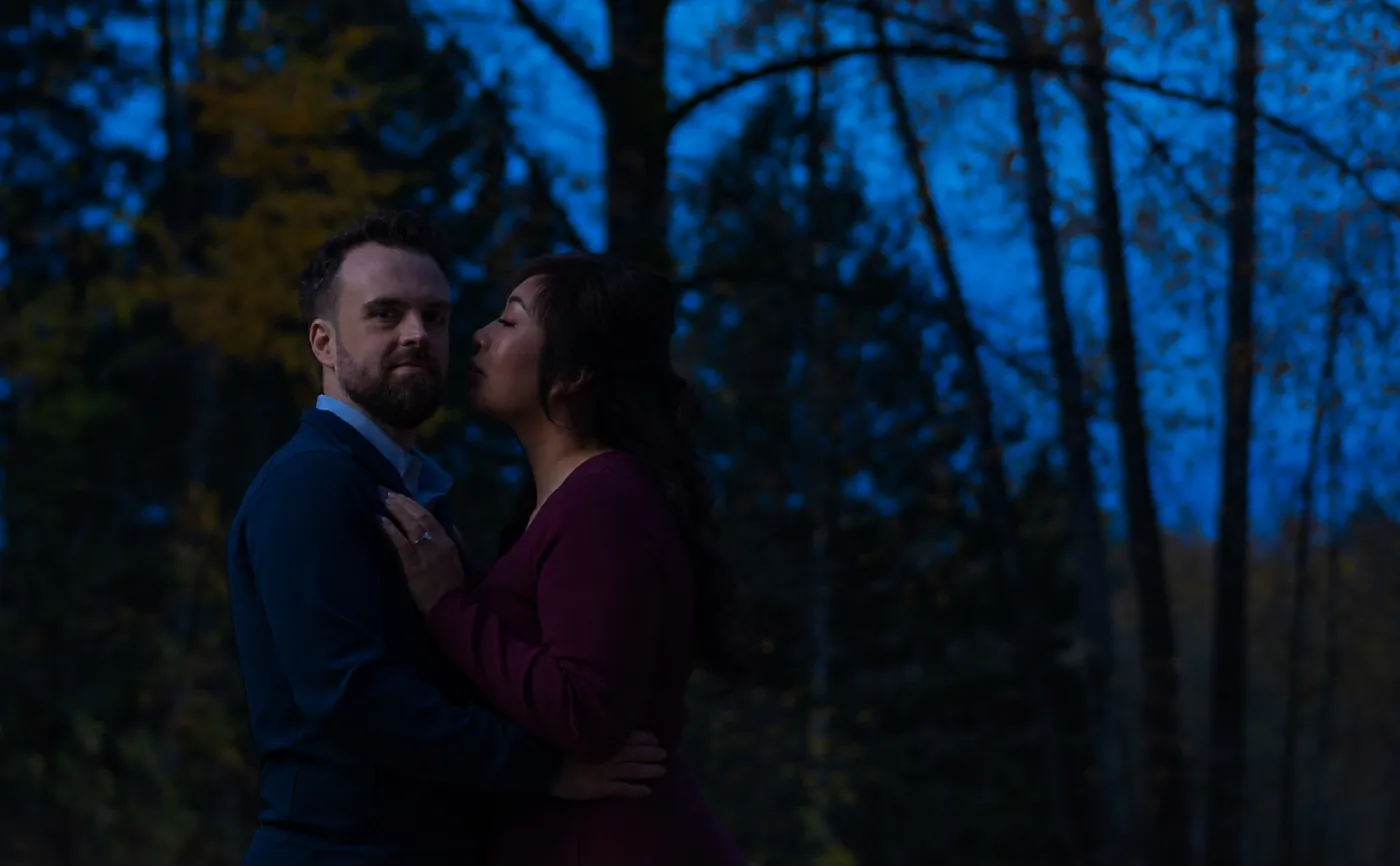 Couple outdoors at dusk with only the available ambient light